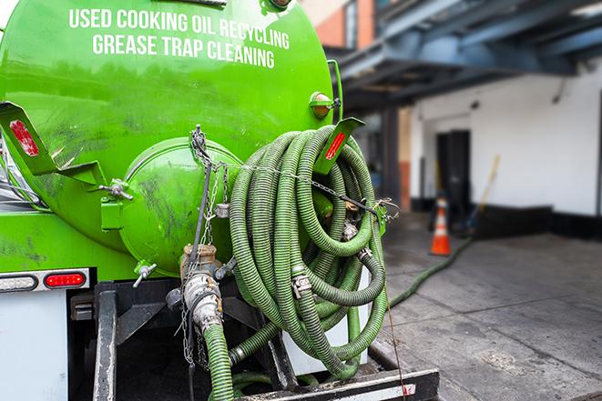 a grease trap pumping truck at a restaurant in Klamath Falls OR