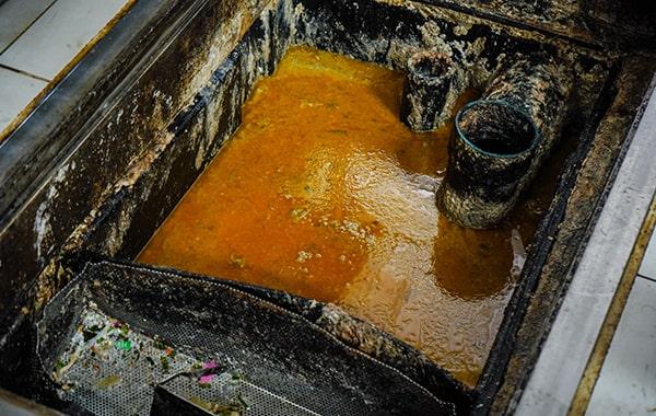 procrastinating on grease trap cleaning can lead to foul odors, clogs, and even fines for non-compliance with regulations